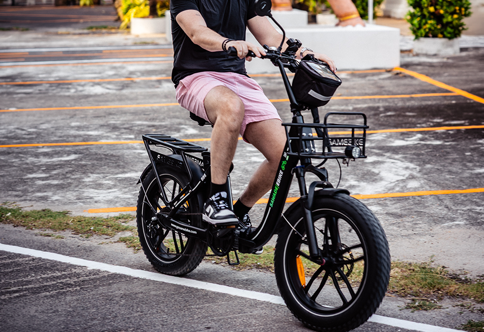Man riding a Sawadeebike Buddy Bike e-bike at Nai Harn temple in southern Phuket