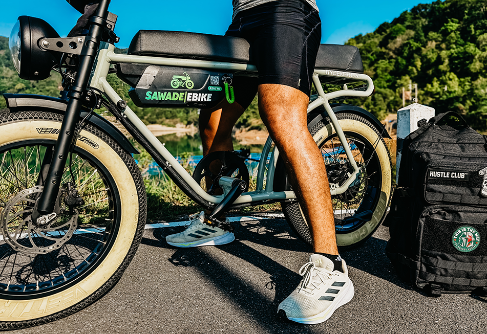 Earl Grey ebike and a sporty rider, detail on battery.